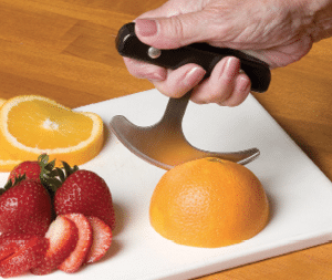 Cutting an orange with a rocker knife 