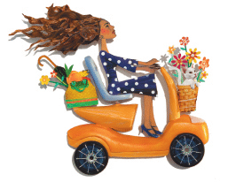 Carefree woman riding a scooter 