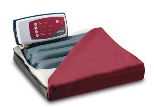 An alternating air pressure seat cushion has air-filled channels that alternately fill and empty to keep weight off bony prominences. It is designed for people who are unable to shift their weight frequently. Photo courtesy of Apex Medical Corp.