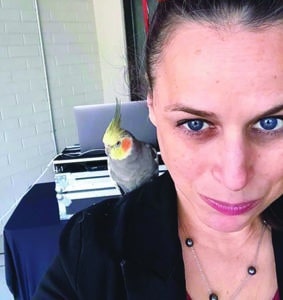 Stephanie Faris with Phoenix the cockatiel on her shoulder