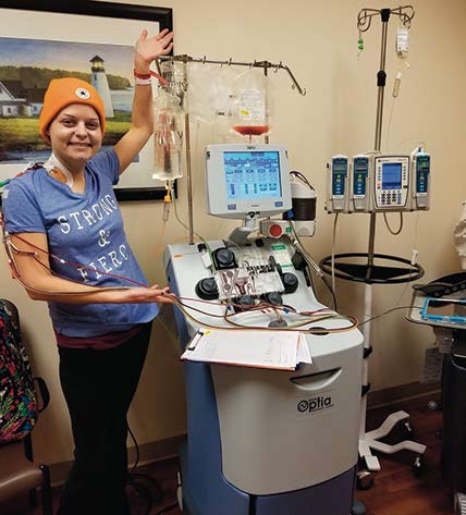 Julie Eberhardt stands among medical machines